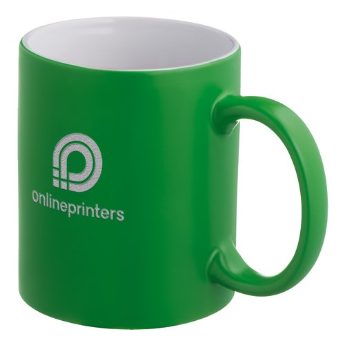 Groene keramische mok met afgeronde handgreep.
